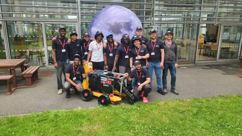 University of Leicester Innova UoL team with rover INNEX-1 in front of the inflatable Moon